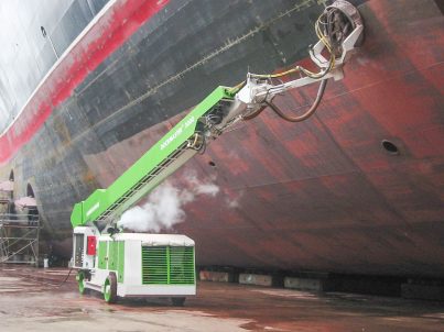 Dockmaster surface preparation machine removing paint from a ship hull.