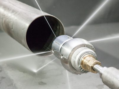 Tube and pipe cleaning nozzle
