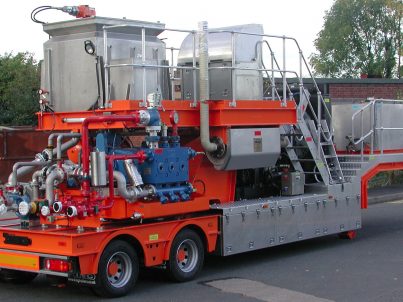Waste injection unit on road-going trailer for onshore well service operations.