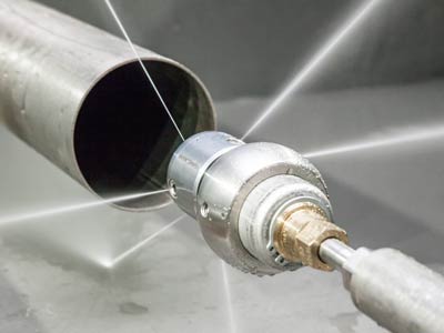 Tube cleaning with high pressure water jetting